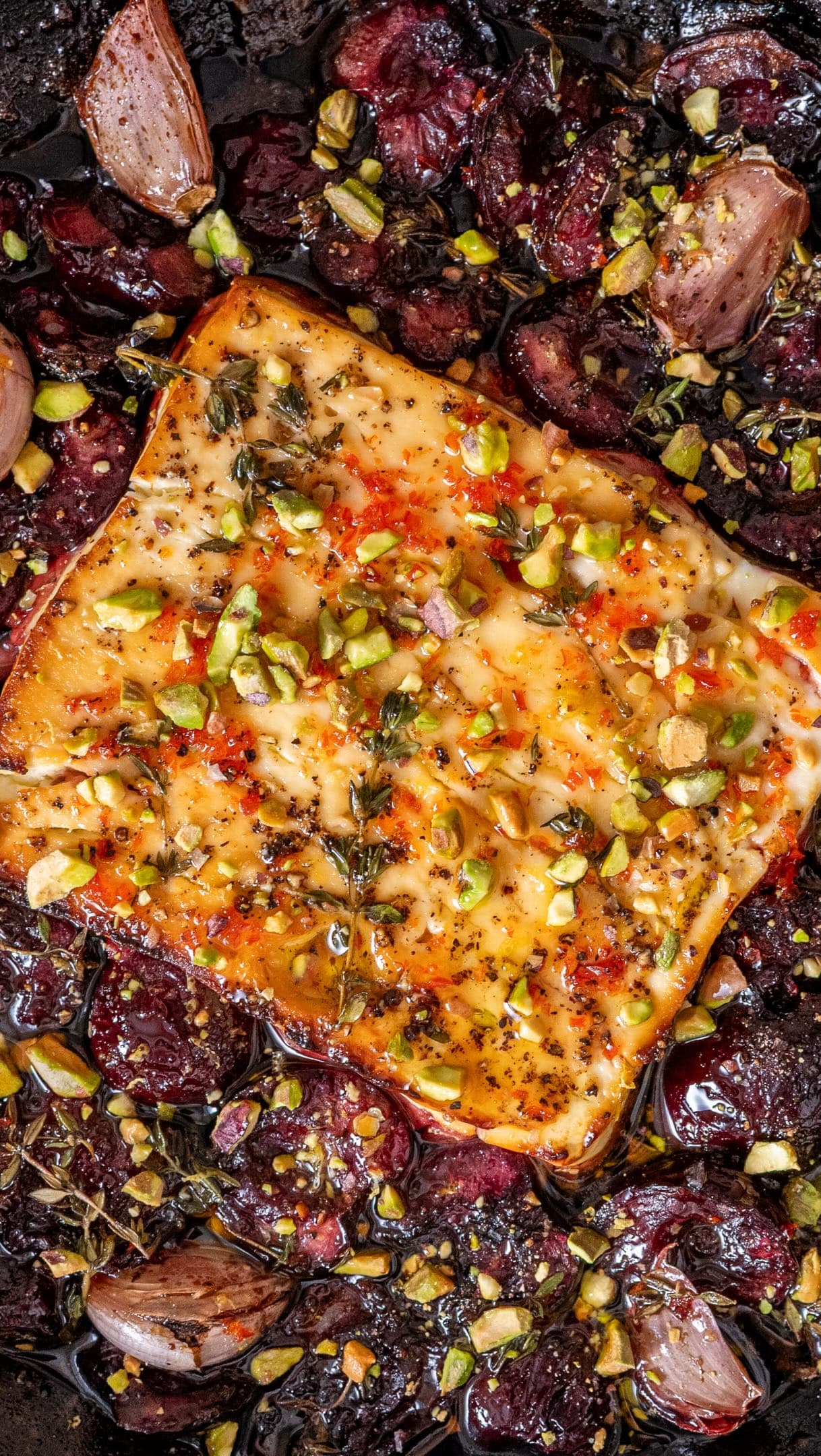 Baked Feta with Jammy Cherries, Hot Honey, Pistachios and Crispy Garlic