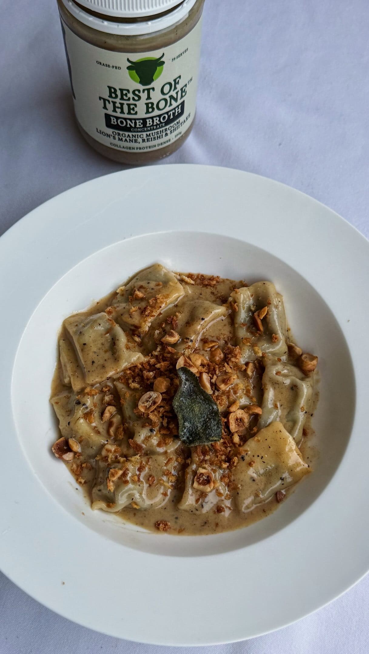 Mushroom & Charred Leek Agnolotti with Mushroom Bone Broth Brown Butter, Crispy Sage & Hazelnut Pangrattato