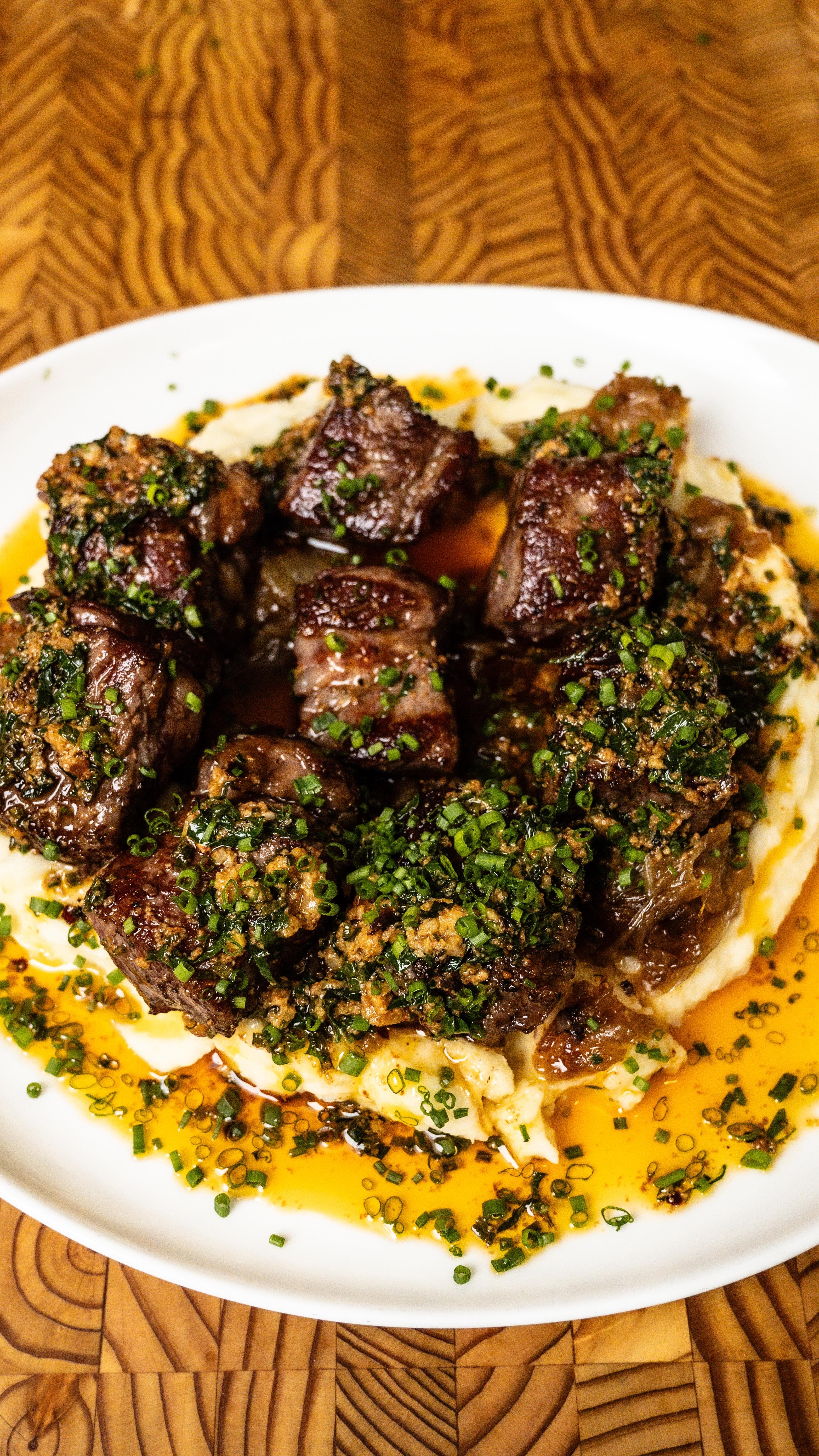 Cowboy Butter Steak Bites with Roasted Garlic Mashed Potatoes and Caramelized Onions