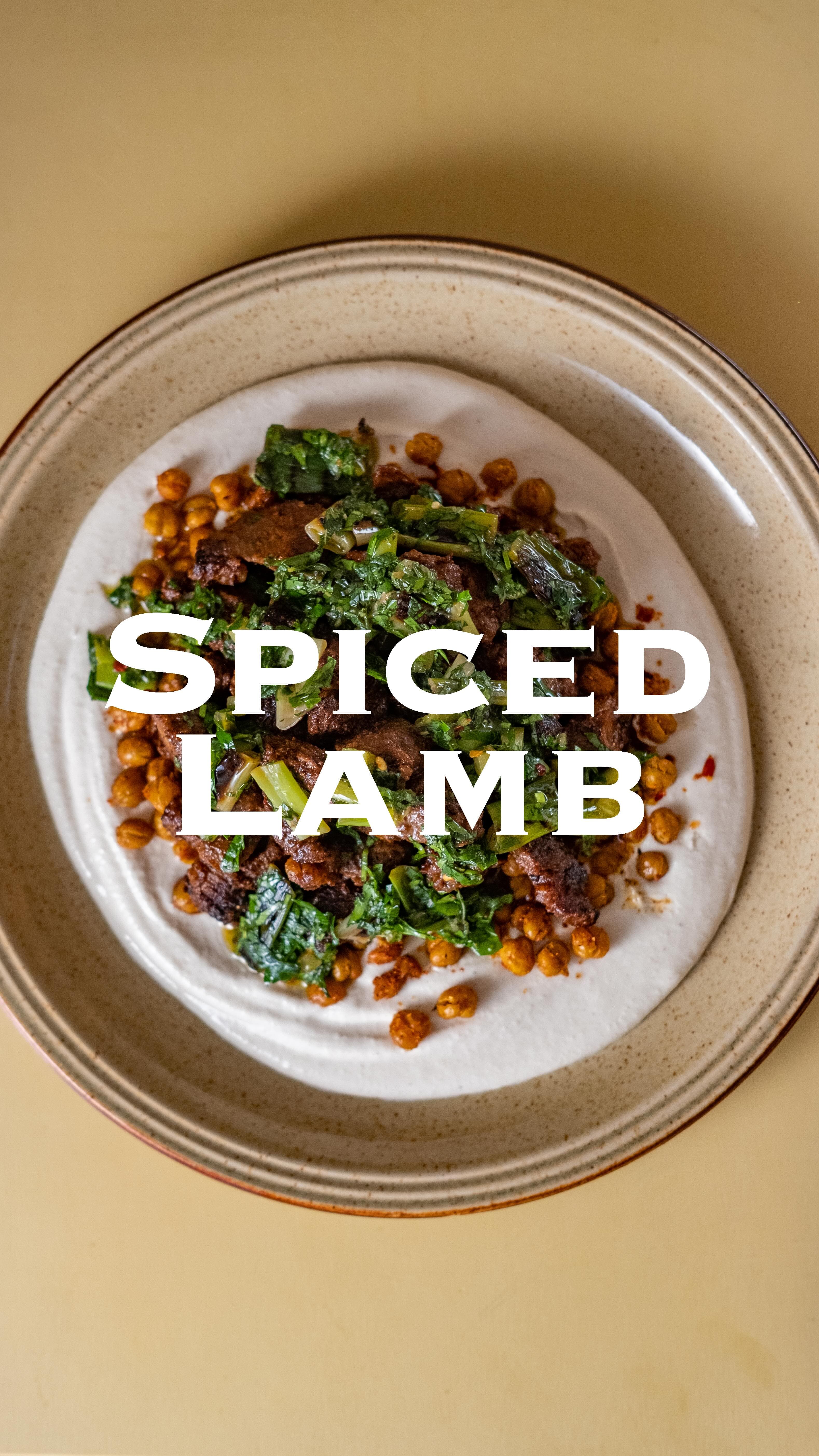 Spiced Lamb with Tahini Yogurt, Crispy Chickpeas and Charred Spring Onion‑Mint Chimichurri