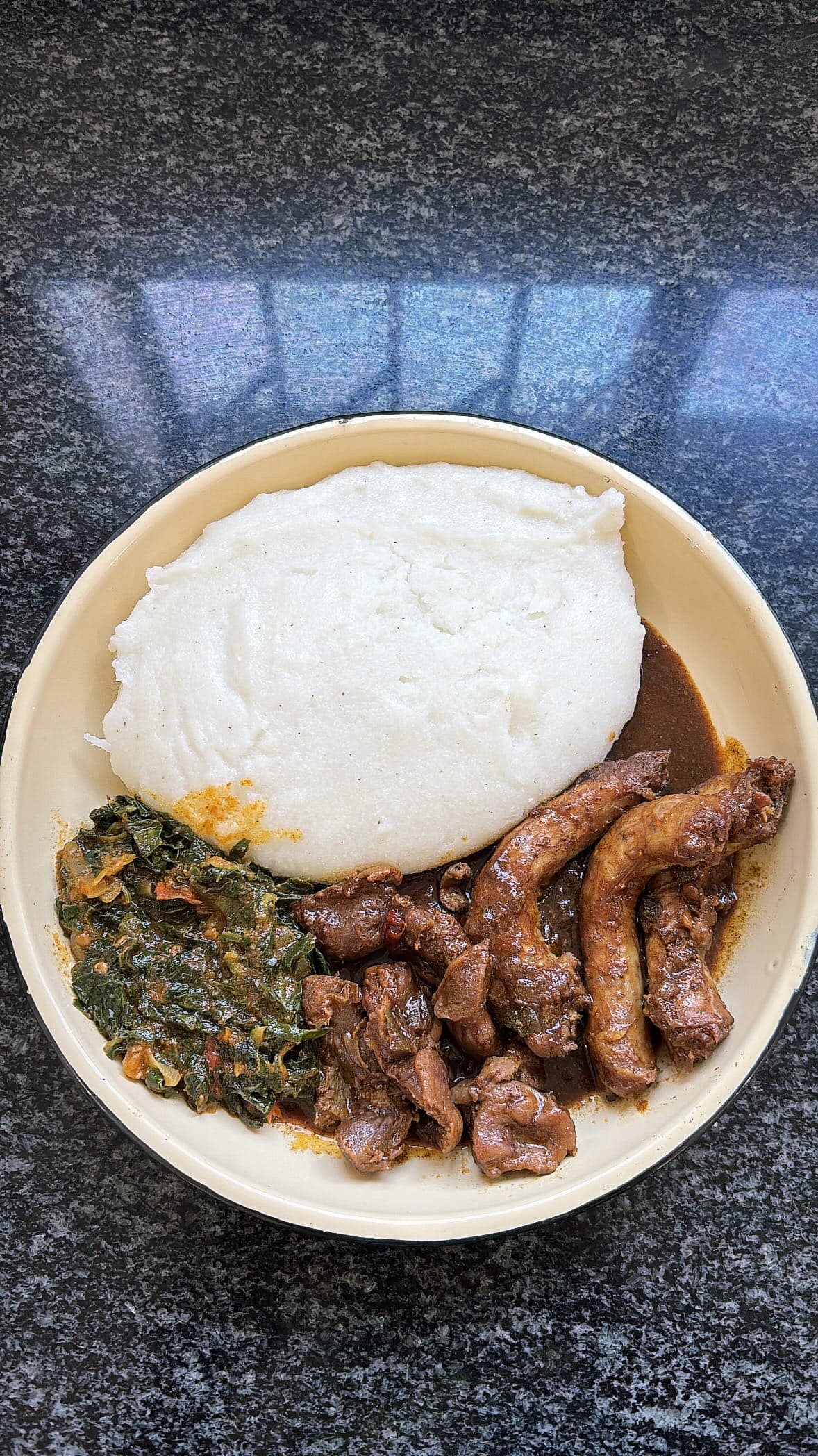 Pap Served With Chicken Gizzard, Chicken Neck and Spinach