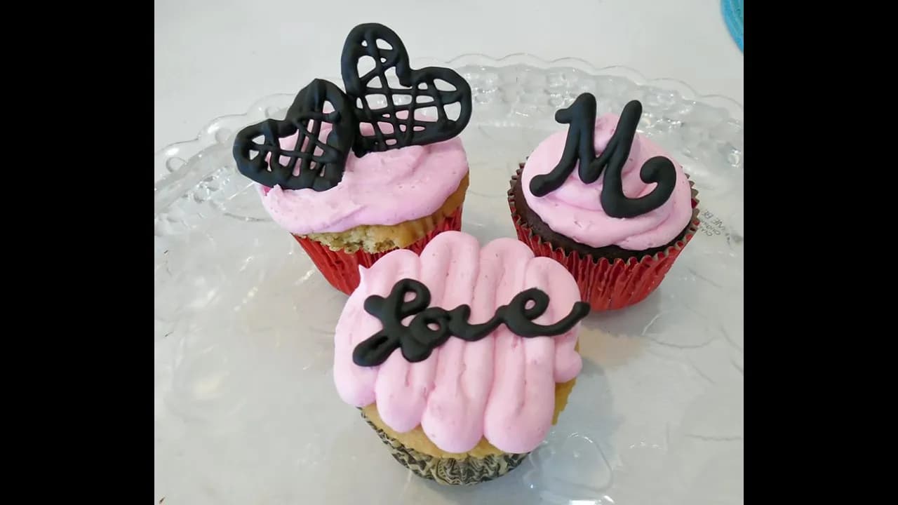 Pink Buttercream Cupcakes with Chocolate Candy Melt Decorations