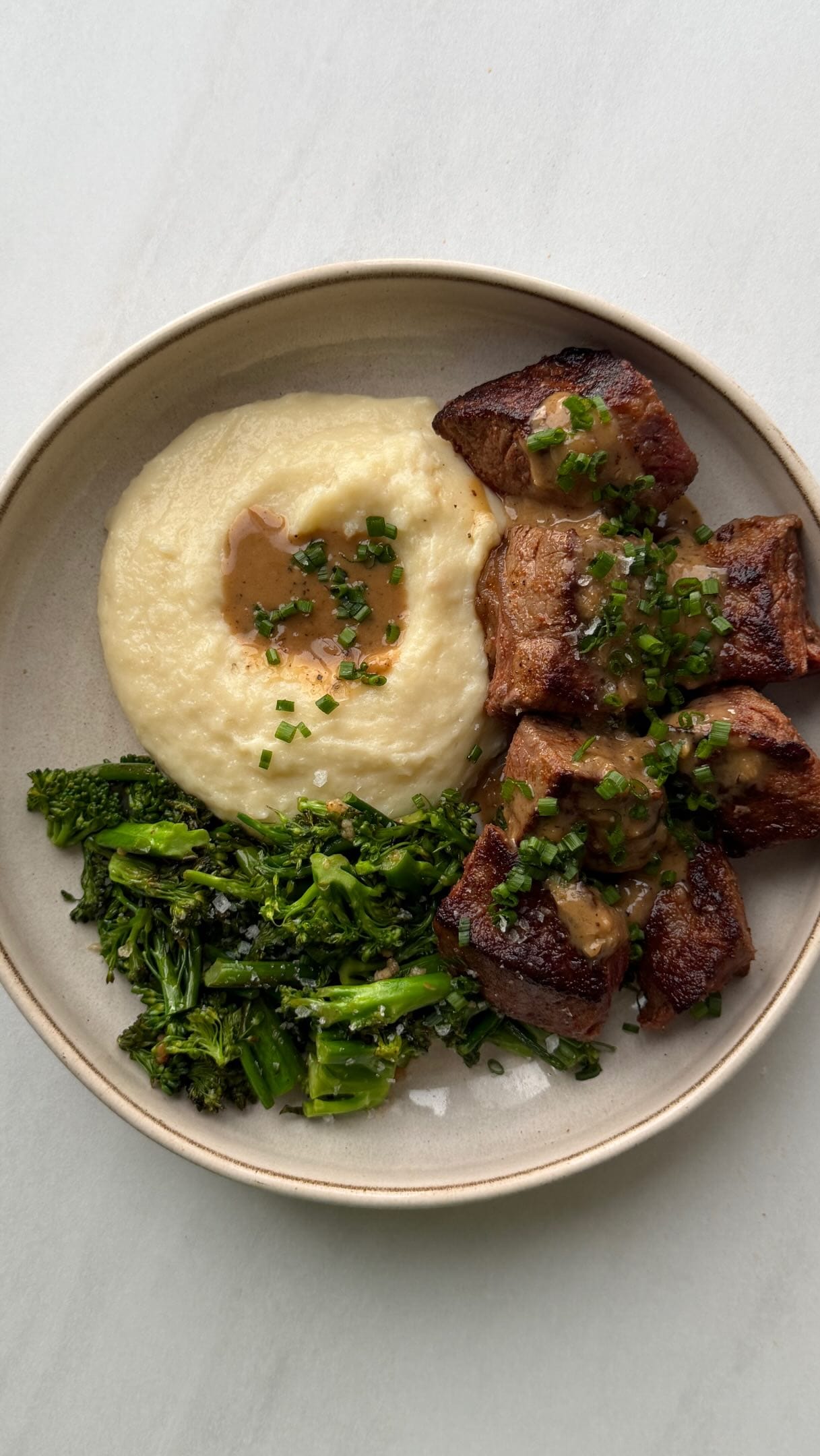 Peppercorn Steak Bites with Roasted Garlic Cheesy Mash