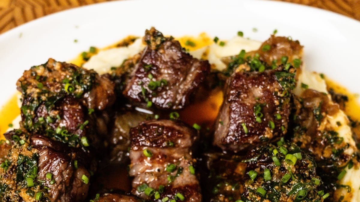 Cowboy Butter Steak Bites with Roasted Garlic Mashed Potatoes and Caramelized Onions