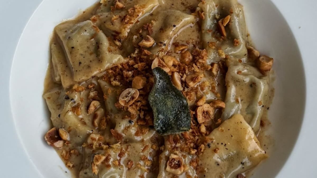 Mushroom & Charred Leek Agnolotti with Mushroom Bone Broth Brown Butter, Crispy Sage & Hazelnut Pangrattato